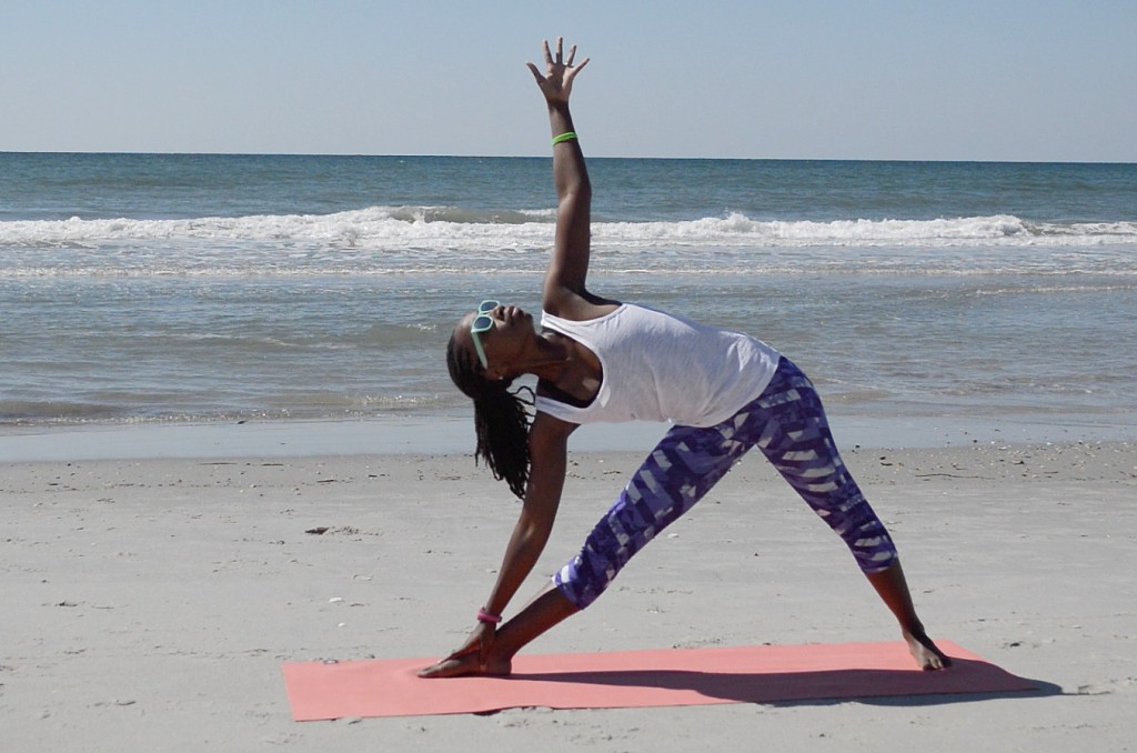 triangle pose on beach