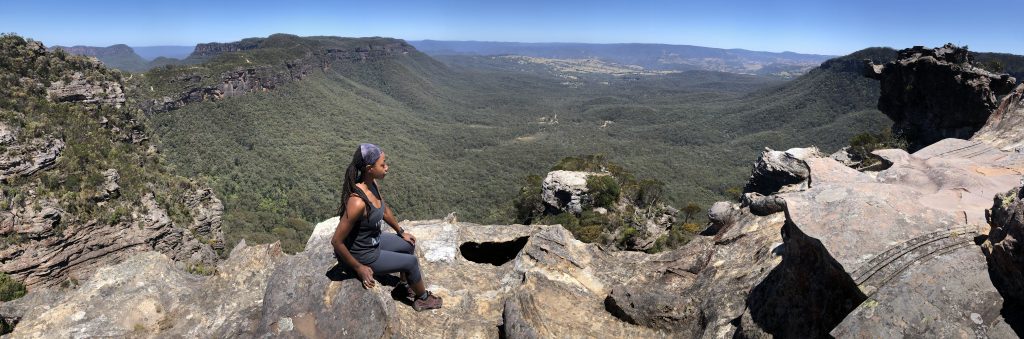 yoga teacher Erica Rascon leads fitness travel to Anvil Rock in Blue Mountains, NSW, Australia