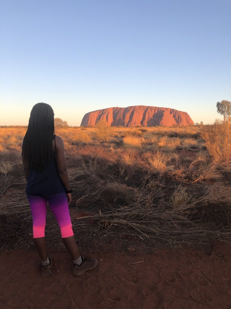 fitness travel blogger Erica Rascon explores Uluru at sunset