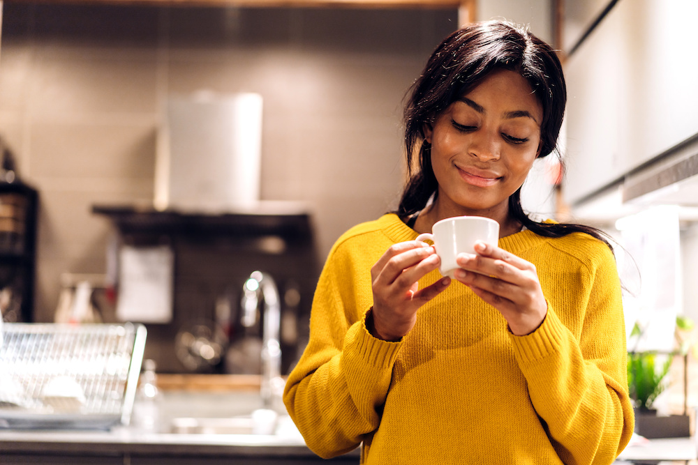 happy black woman increasing serotonin using herbs