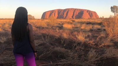 fitness travel blogger Erica Rascon explores Uluru at sunset